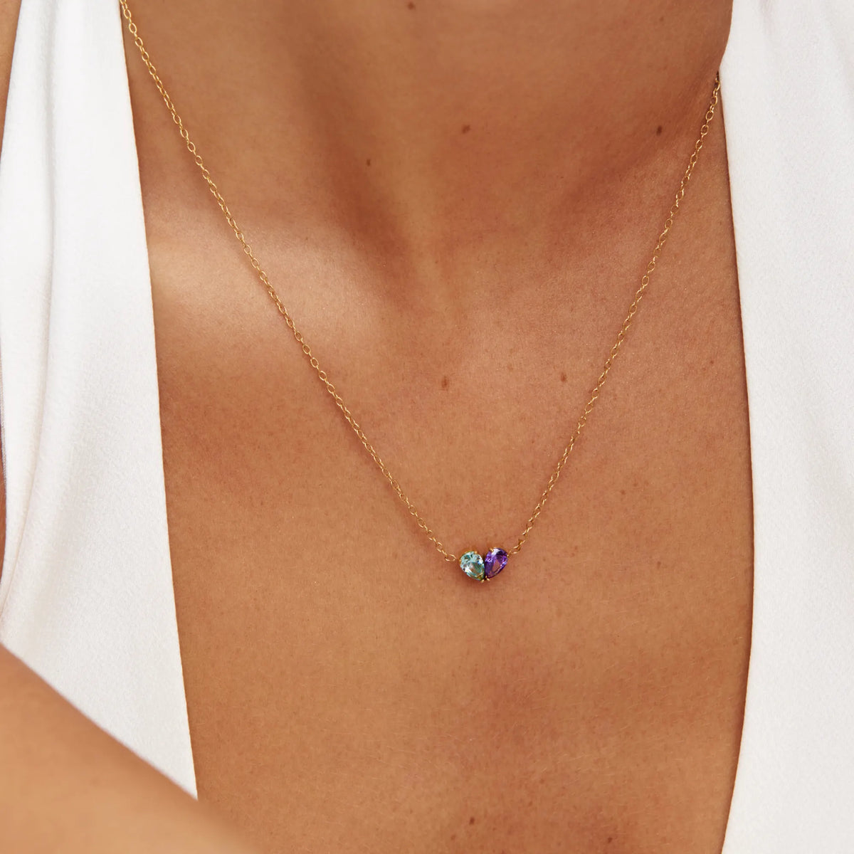 Close-up of Duo Heart Necklace, two teardrop stones forming a heart