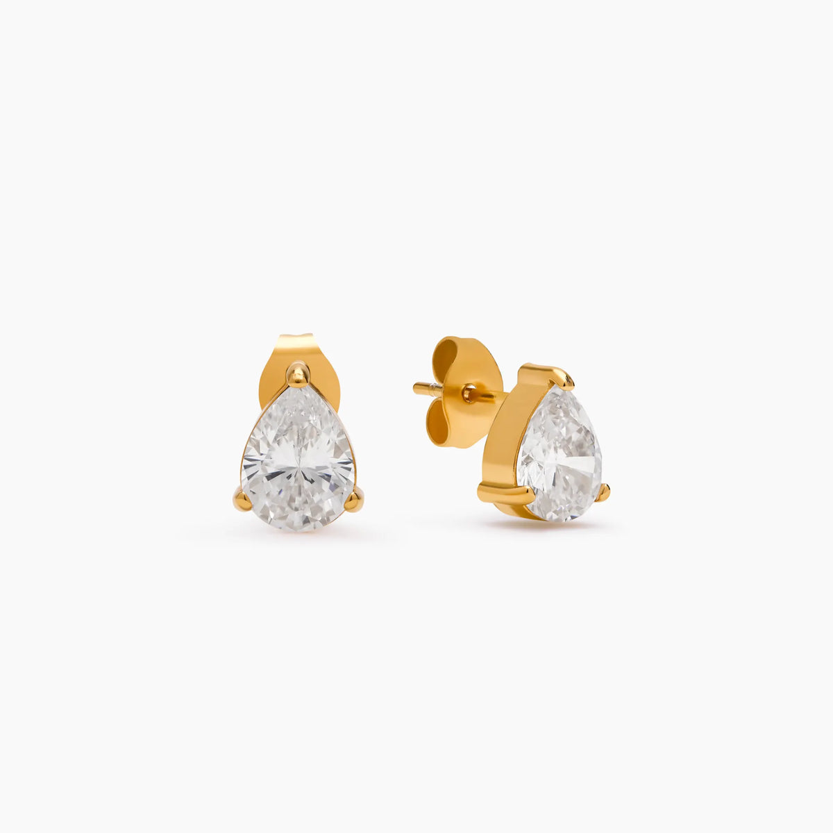 Pear Studs in gold, teardrop clear stones held by small claws