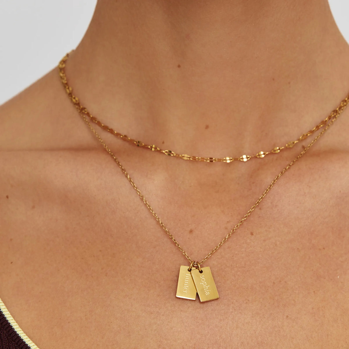 Close-up of Tag Name Necklace with two name tags, layered